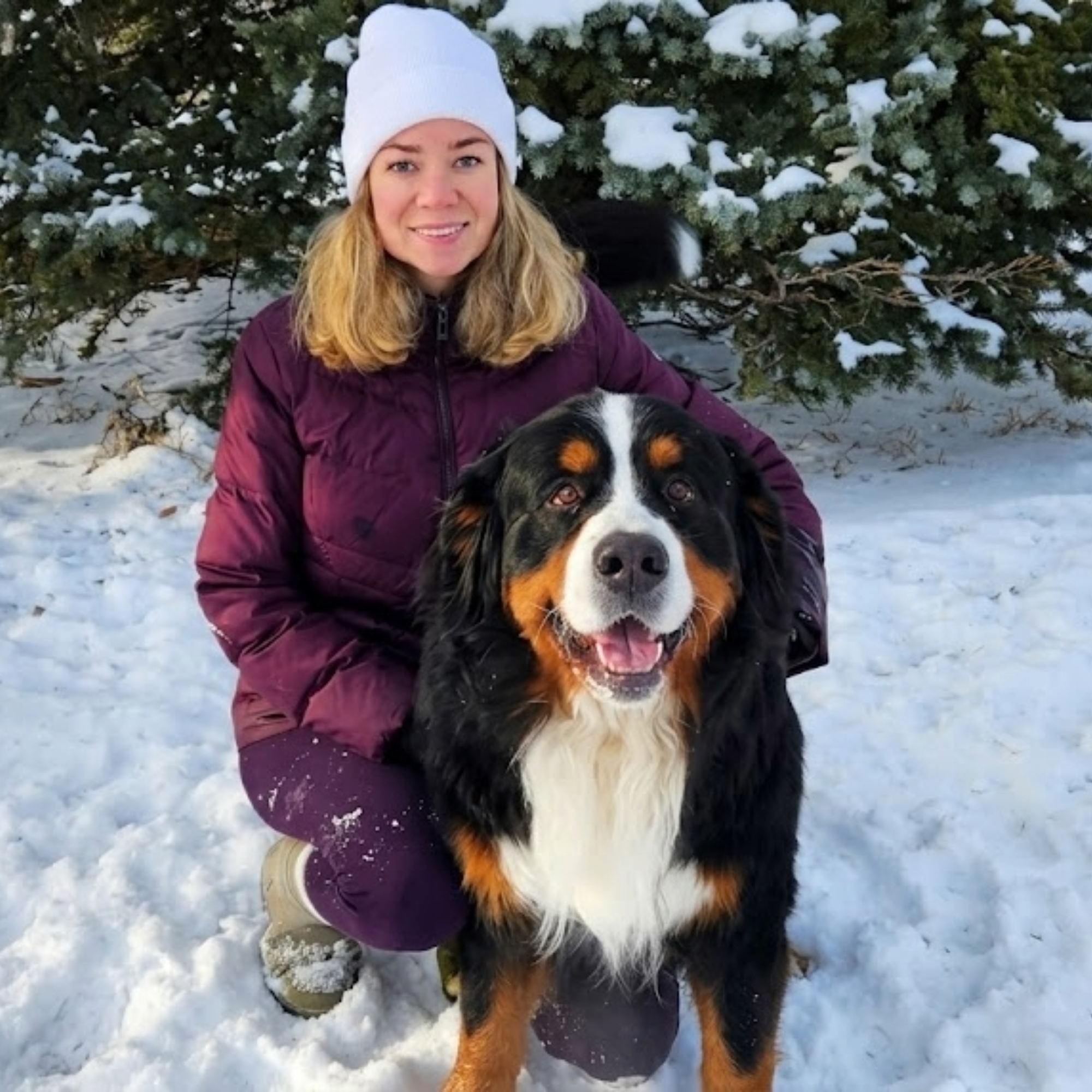 Paws On A Journey founder with a Bernese Mountain Dog in the snow
